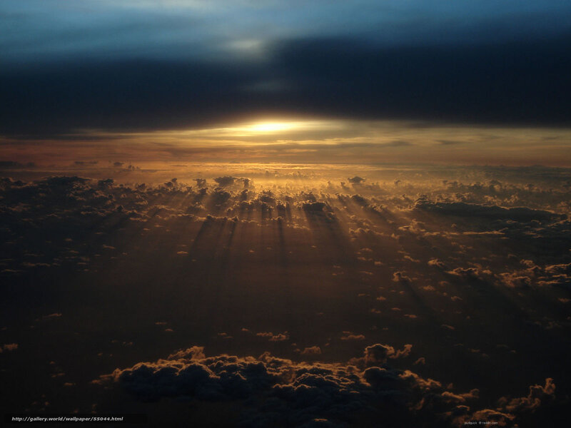 Sunset rays over clouds