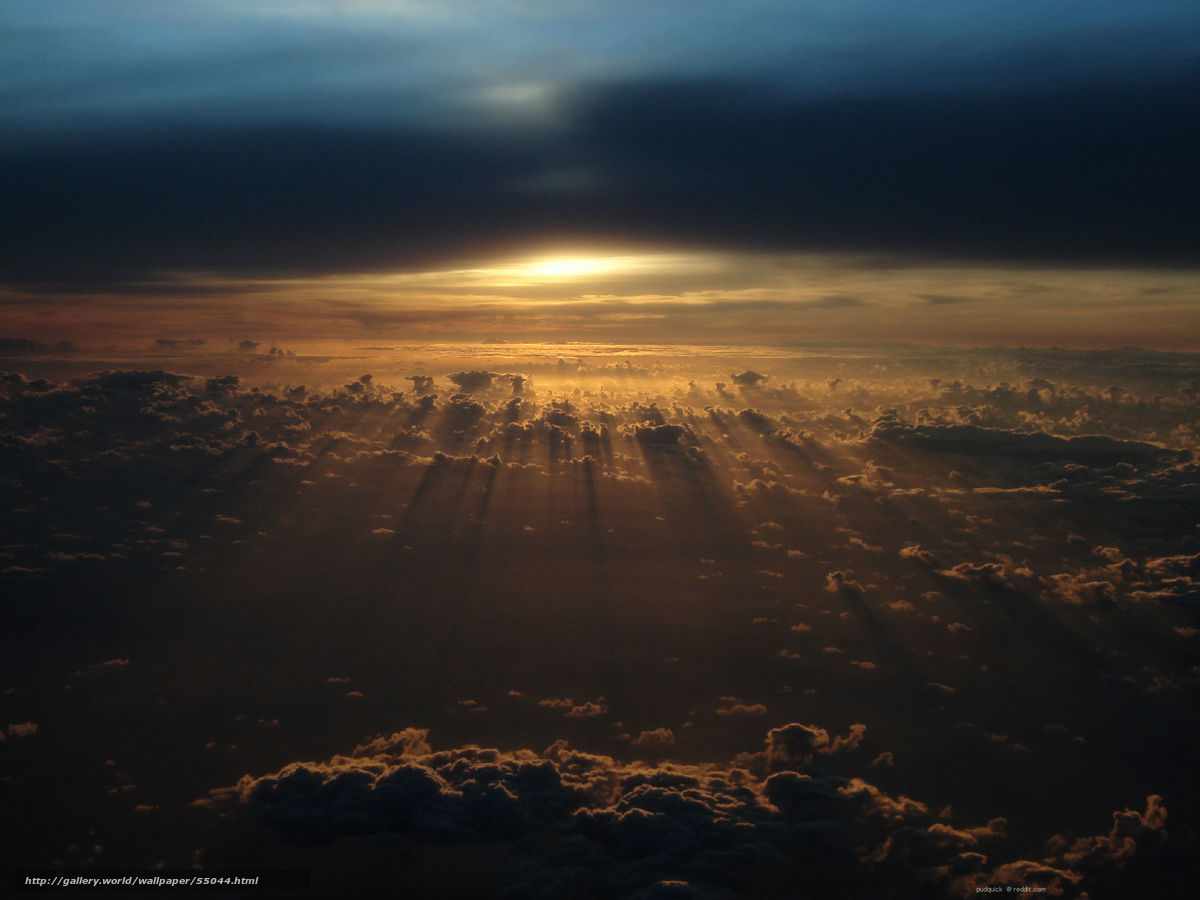 Sunset rays over clouds