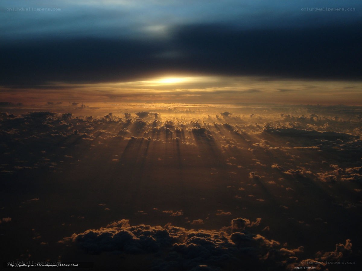 Sunset rays over clouds