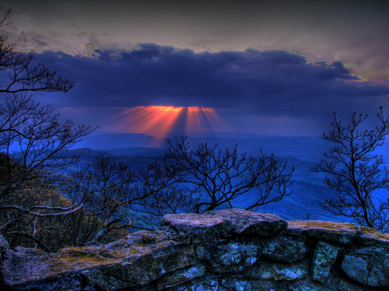 Sunset rays over mountain range