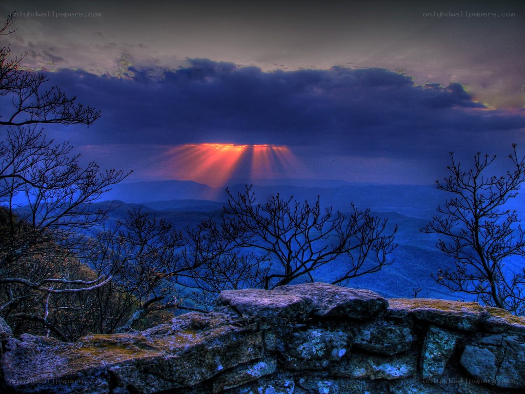 Sunset rays over mountain range