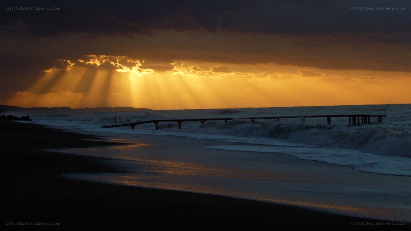 Sunset rays over ocean pier