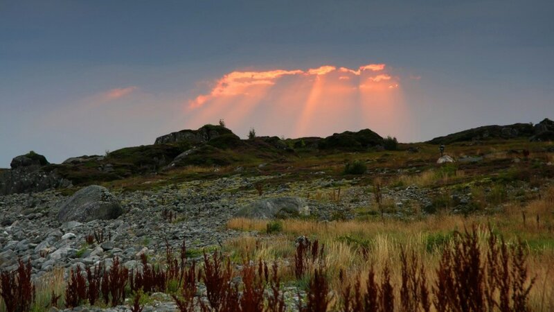 Sunset rays over rocky landscape