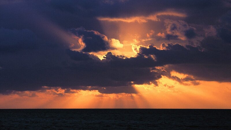 Sunset rays over the ocean