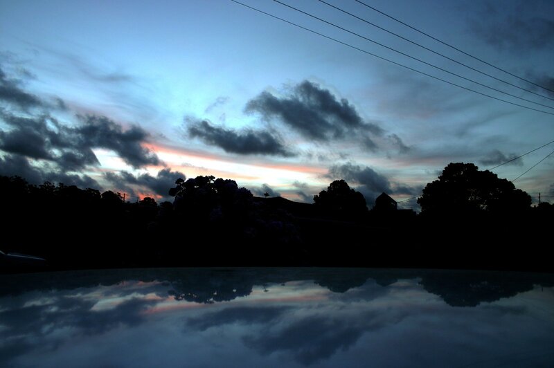 sunset reflected in car roof