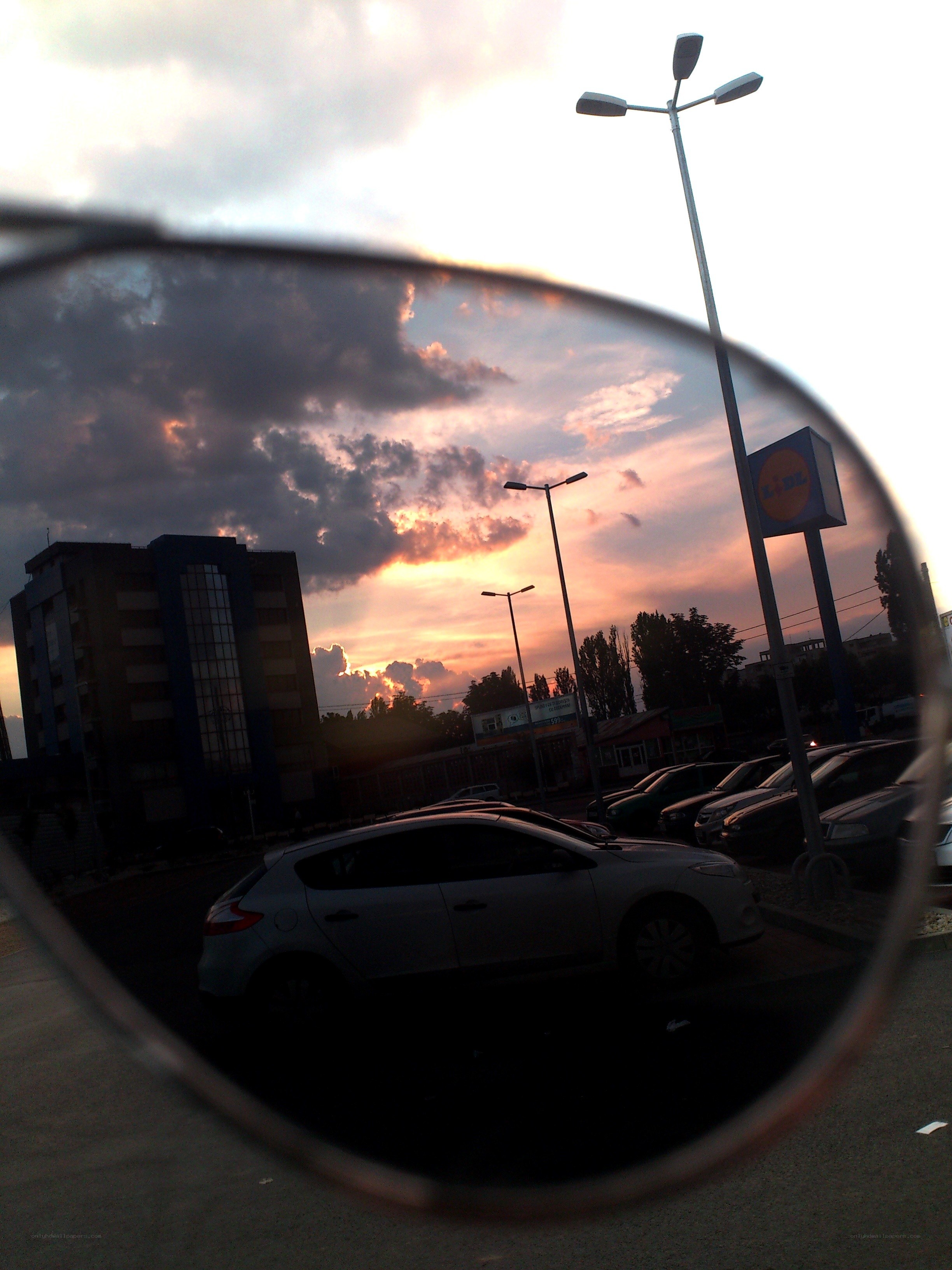 sunset reflected in sunglasses