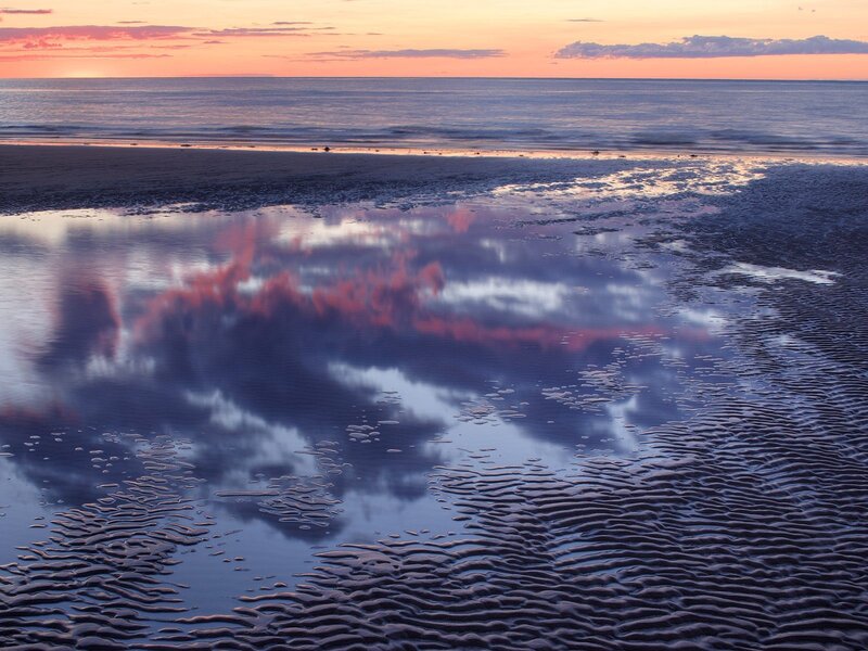 Sunset reflection on beach
