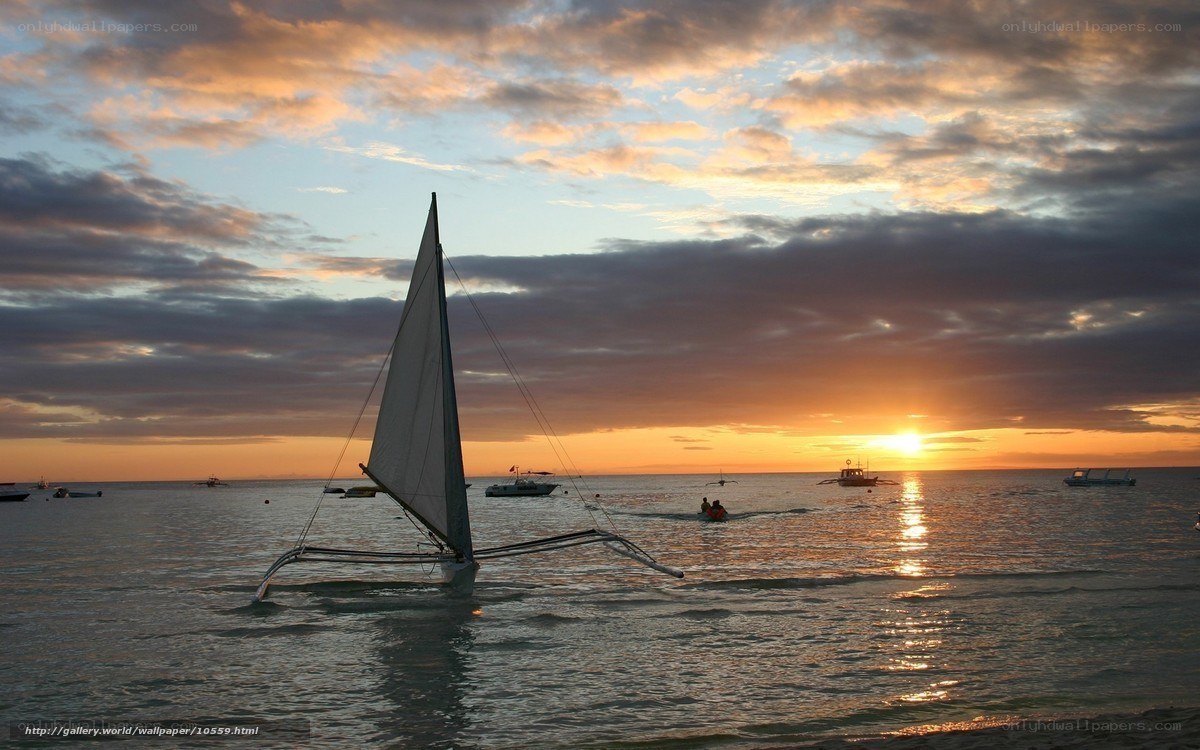 Sunset sailboat at the beach