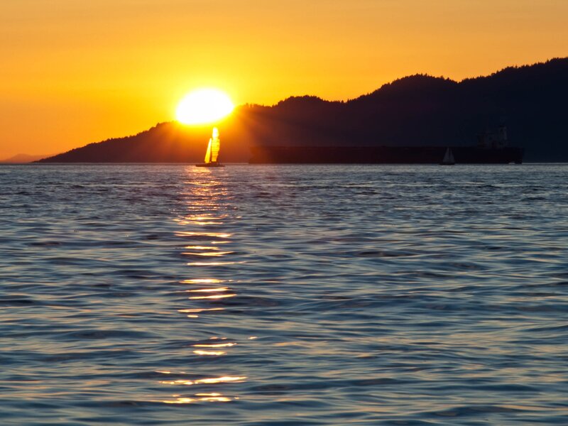 Sunset sailboat on calm water