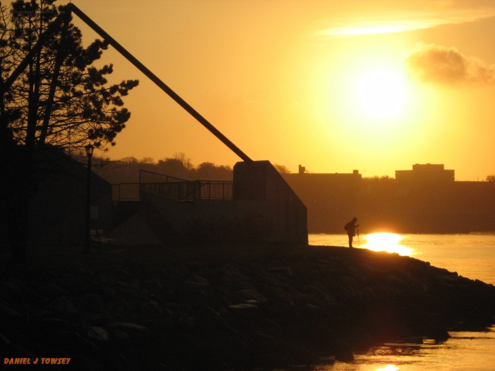 Sunset silhouette by the water