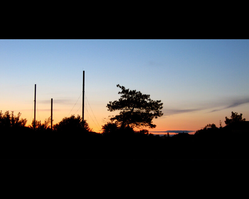sunset silhouette with poles