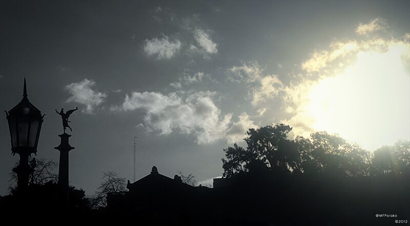 Sunset silhouette with statue