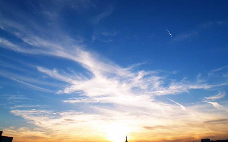 sunset sky with contrail