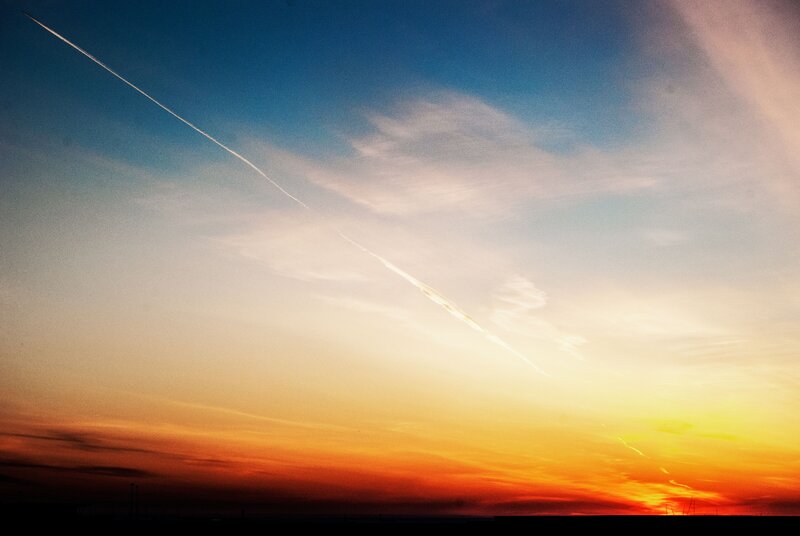 Sunset sky with contrail
