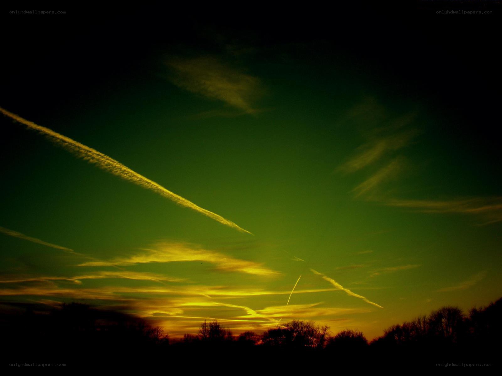 Sunset sky with contrails
