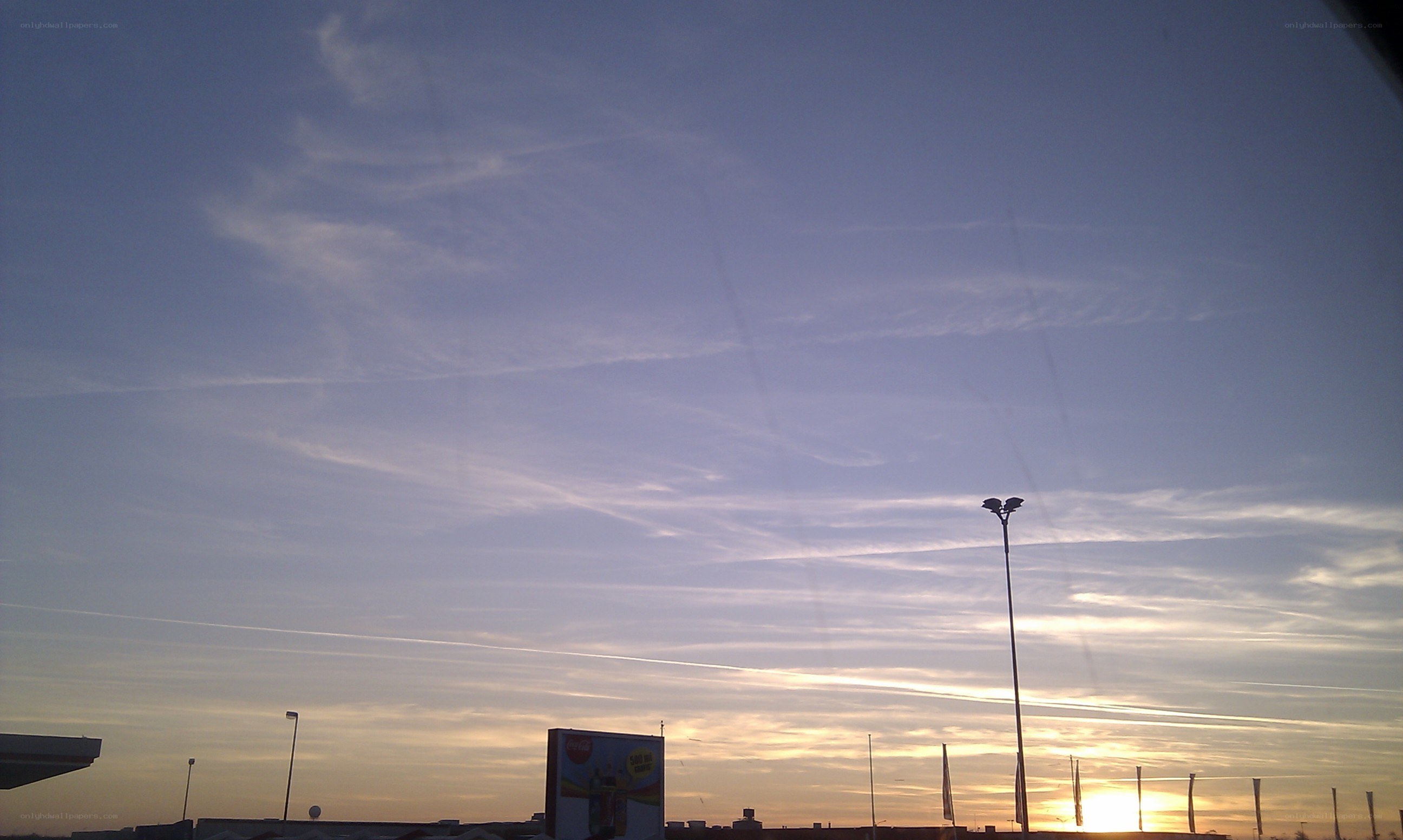 sunset sky with contrails