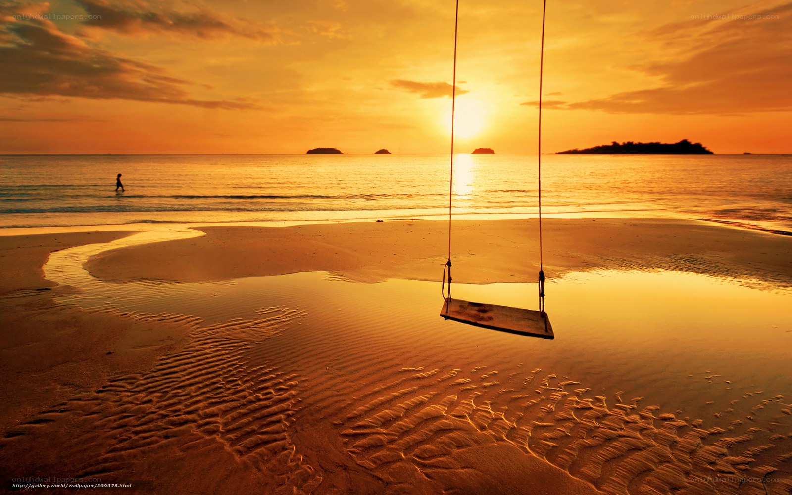 Sunset swing on the beach