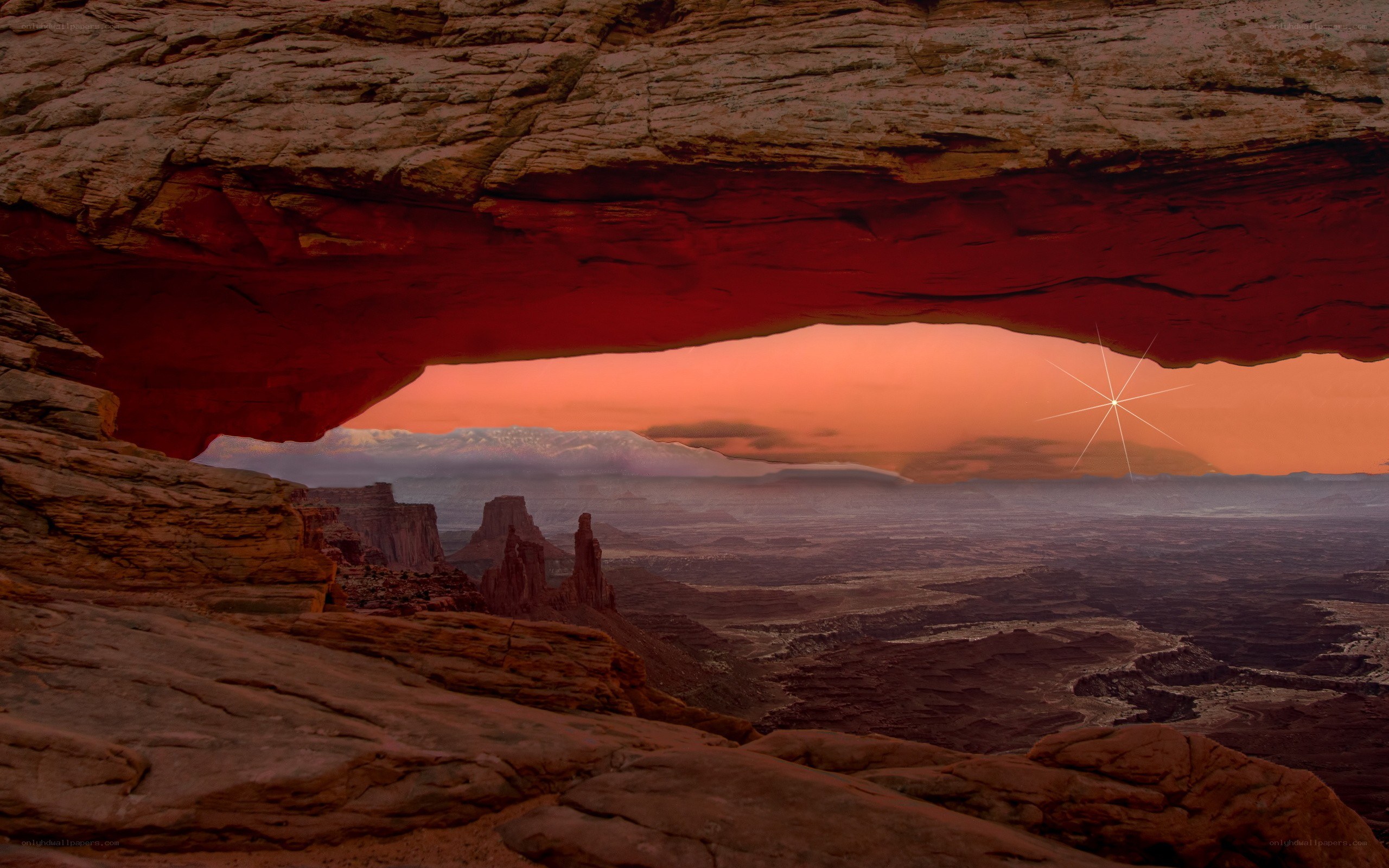Sunset through a natural arch