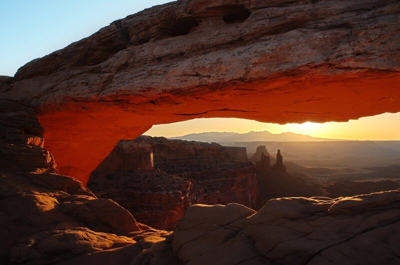 Sunset through a natural arch