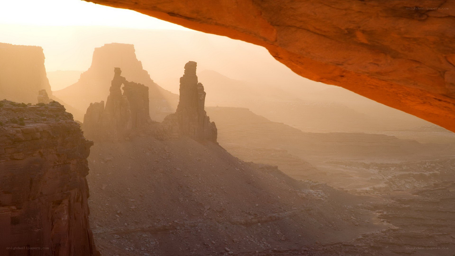 Sunset through a natural arch