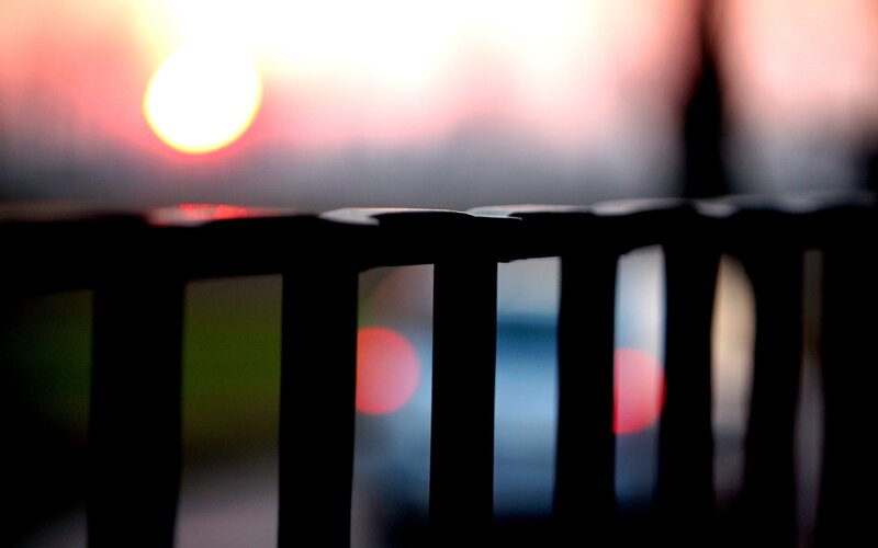 Sunset through a railing