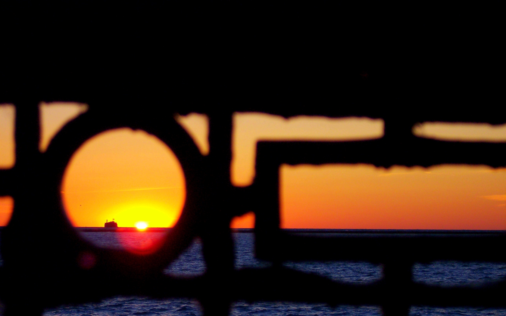 Sunset through a railing