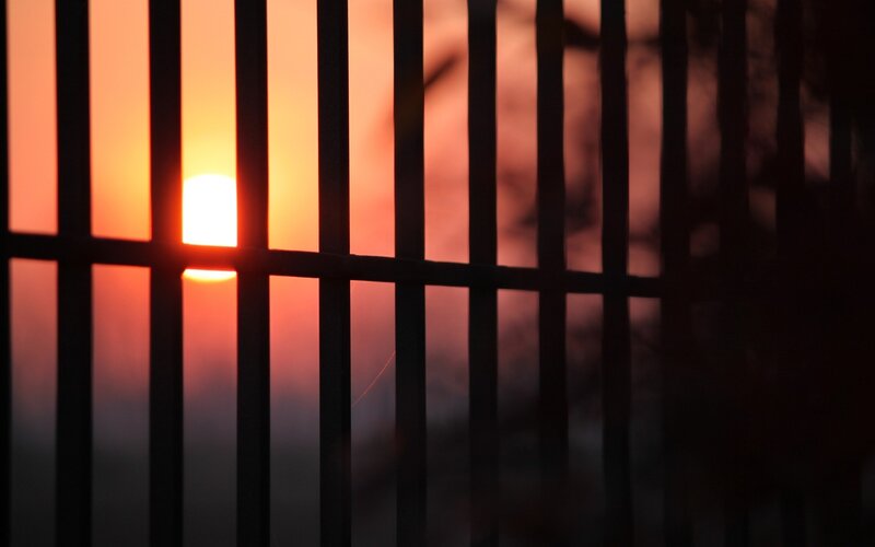 Sunset Through Bars