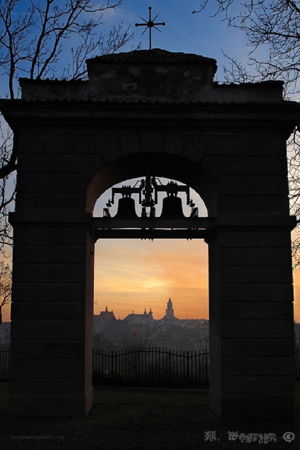 Sunset through bell tower arch