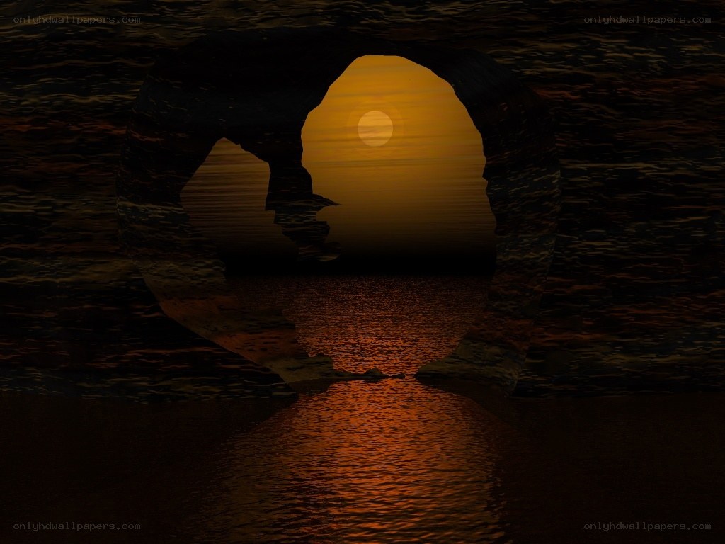 Sunset through cave arch