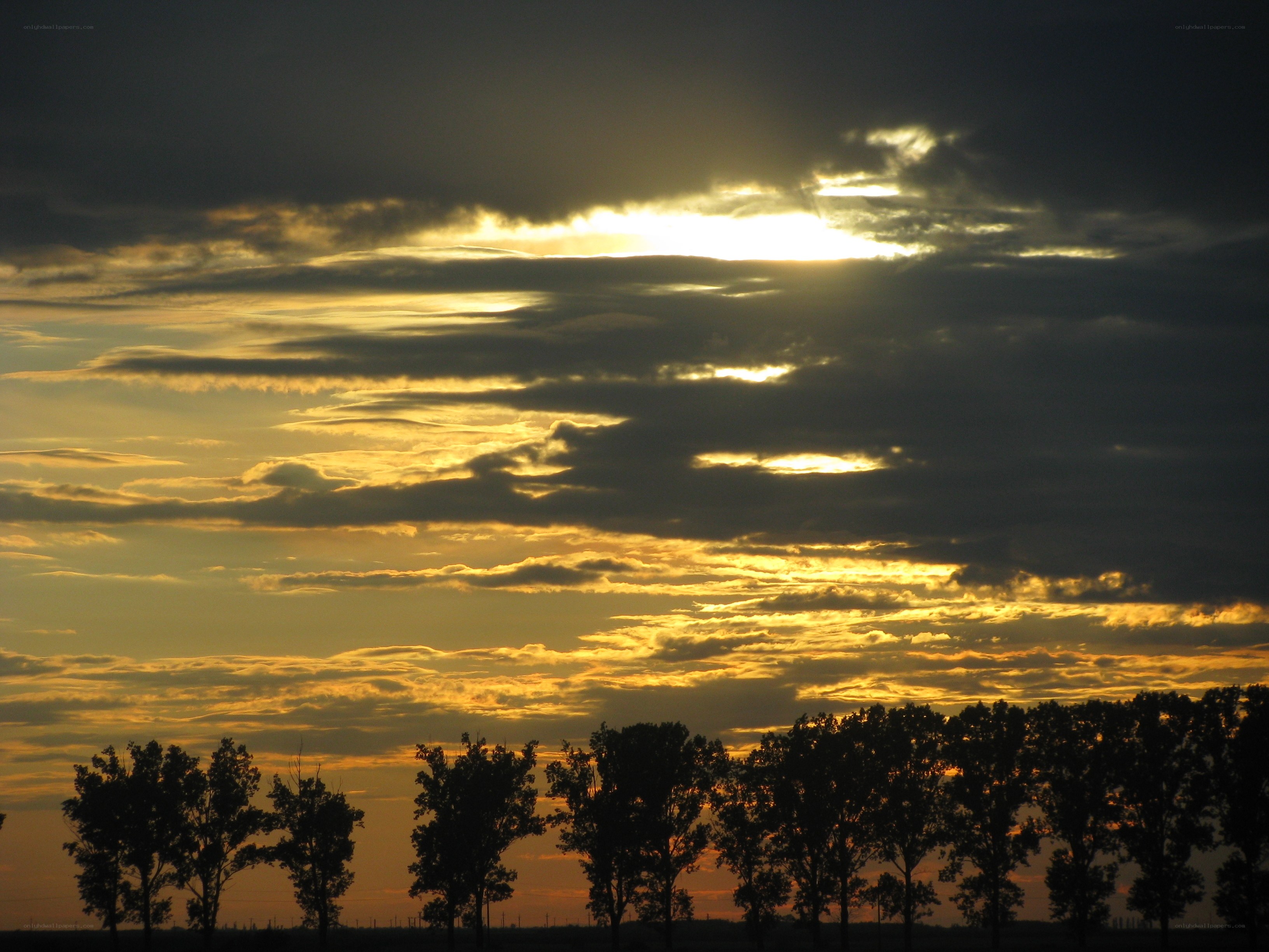 sunset through clouds