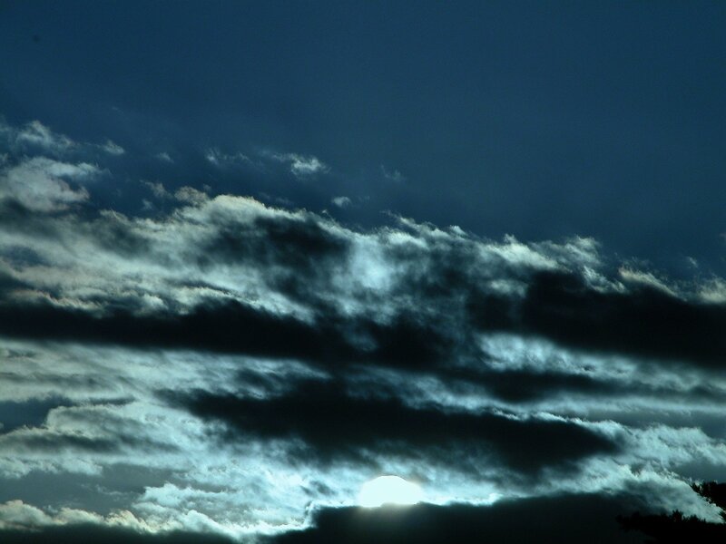 Sunset through dark clouds