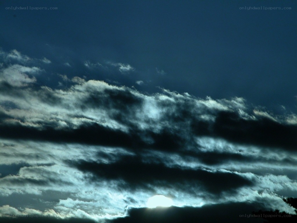 Sunset through dark clouds