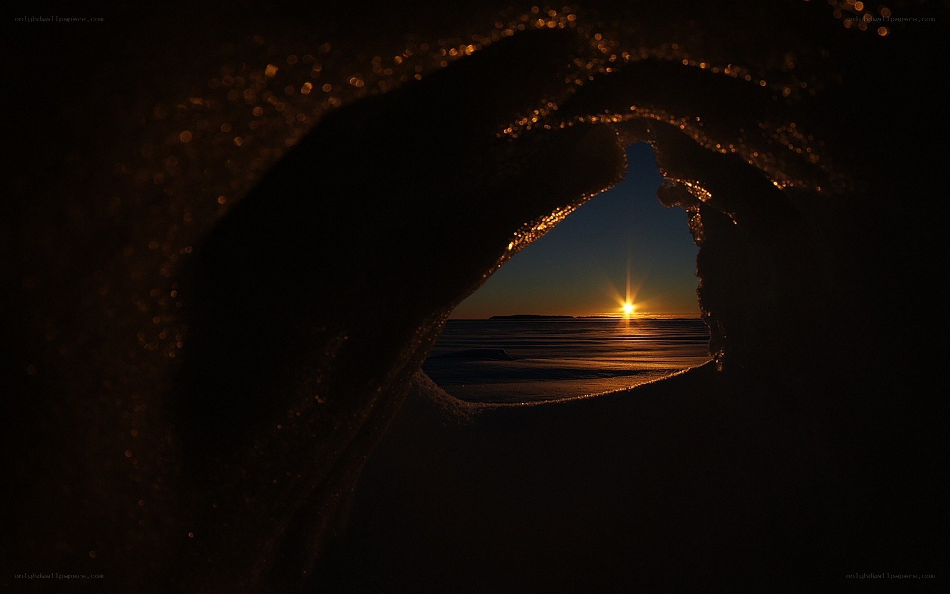 Sunset through ice tunnel