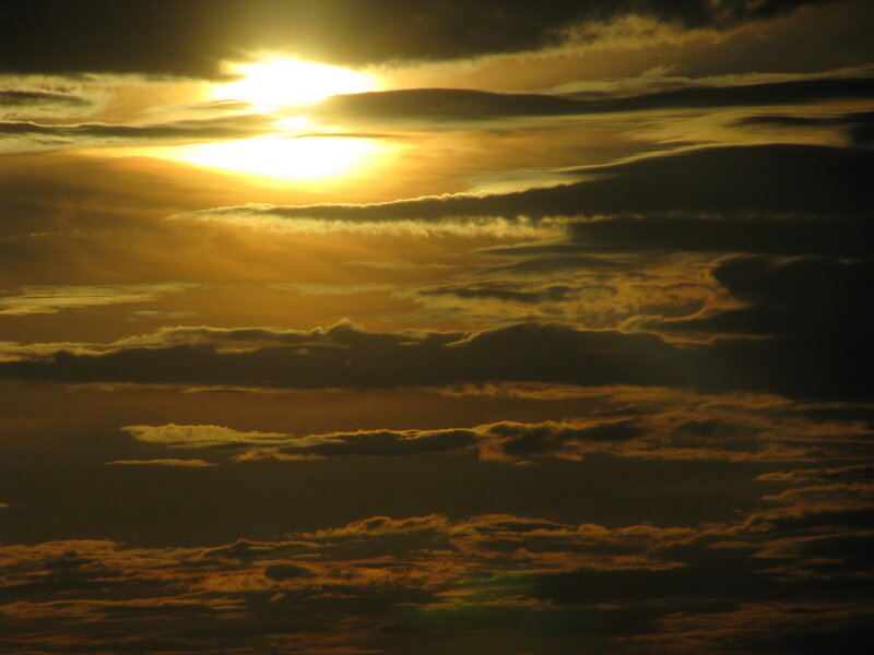 Sunset through layered clouds