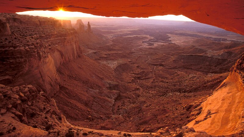 Sunset through natural arch
