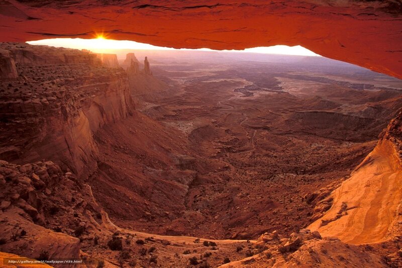 Sunset through natural arch