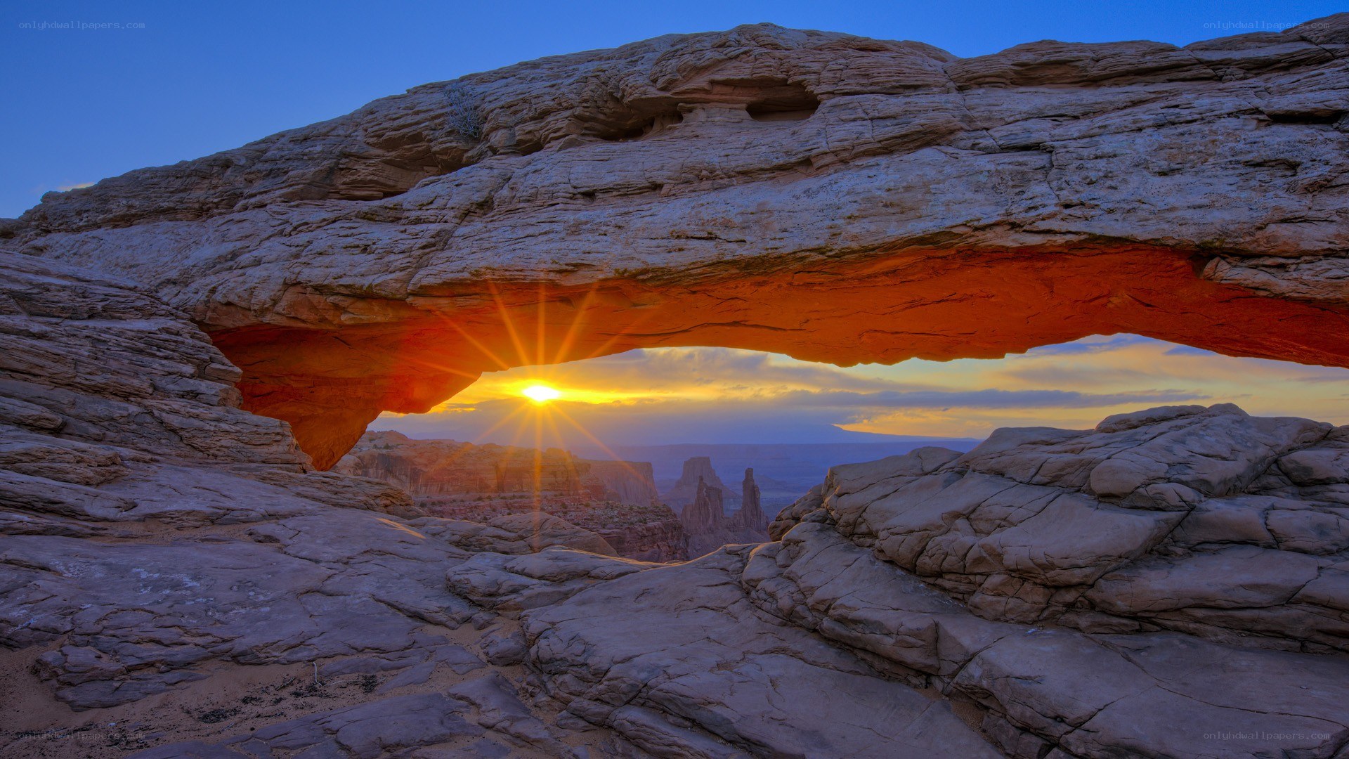 Sunset through natural rock arch