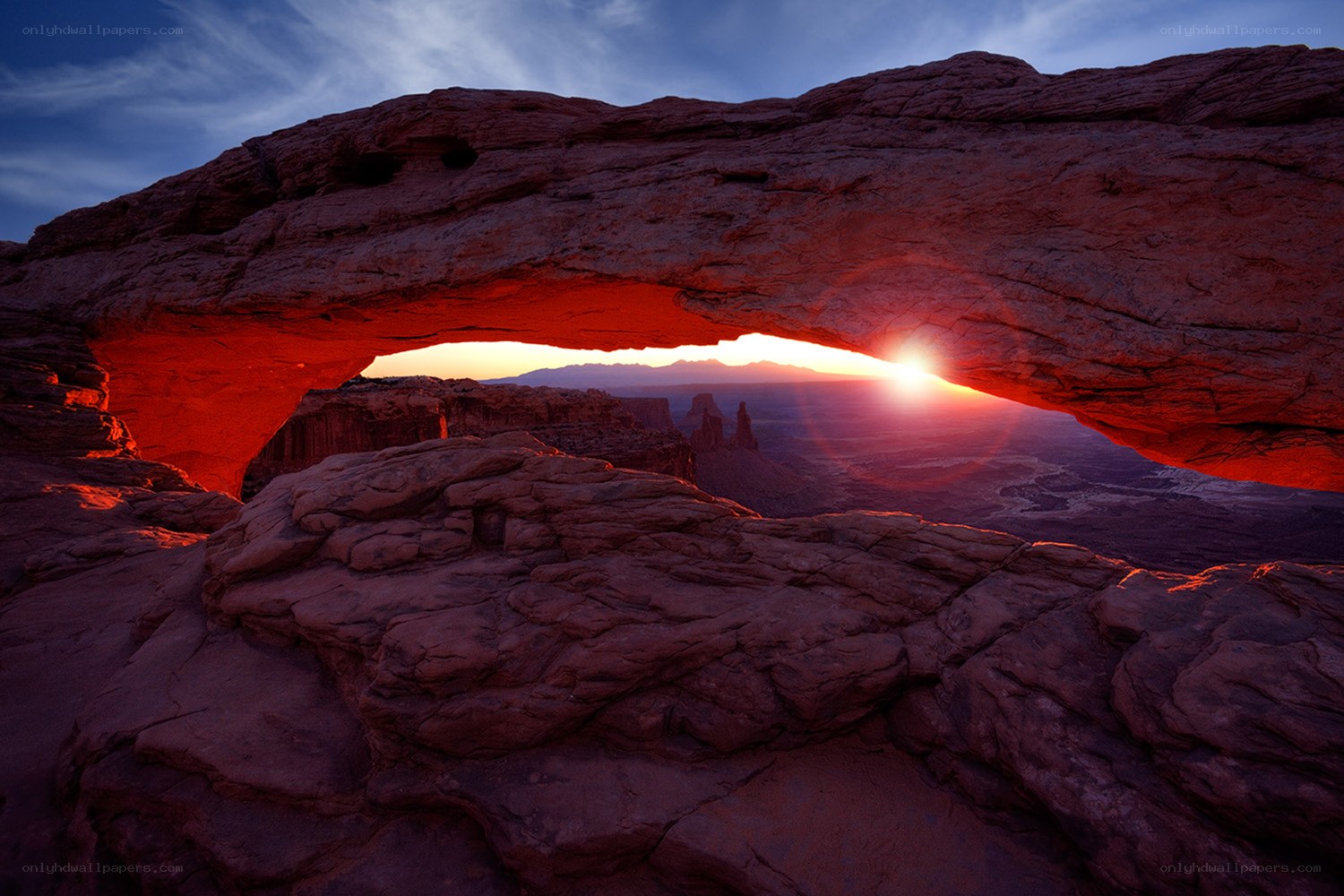Sunset through natural rock arch