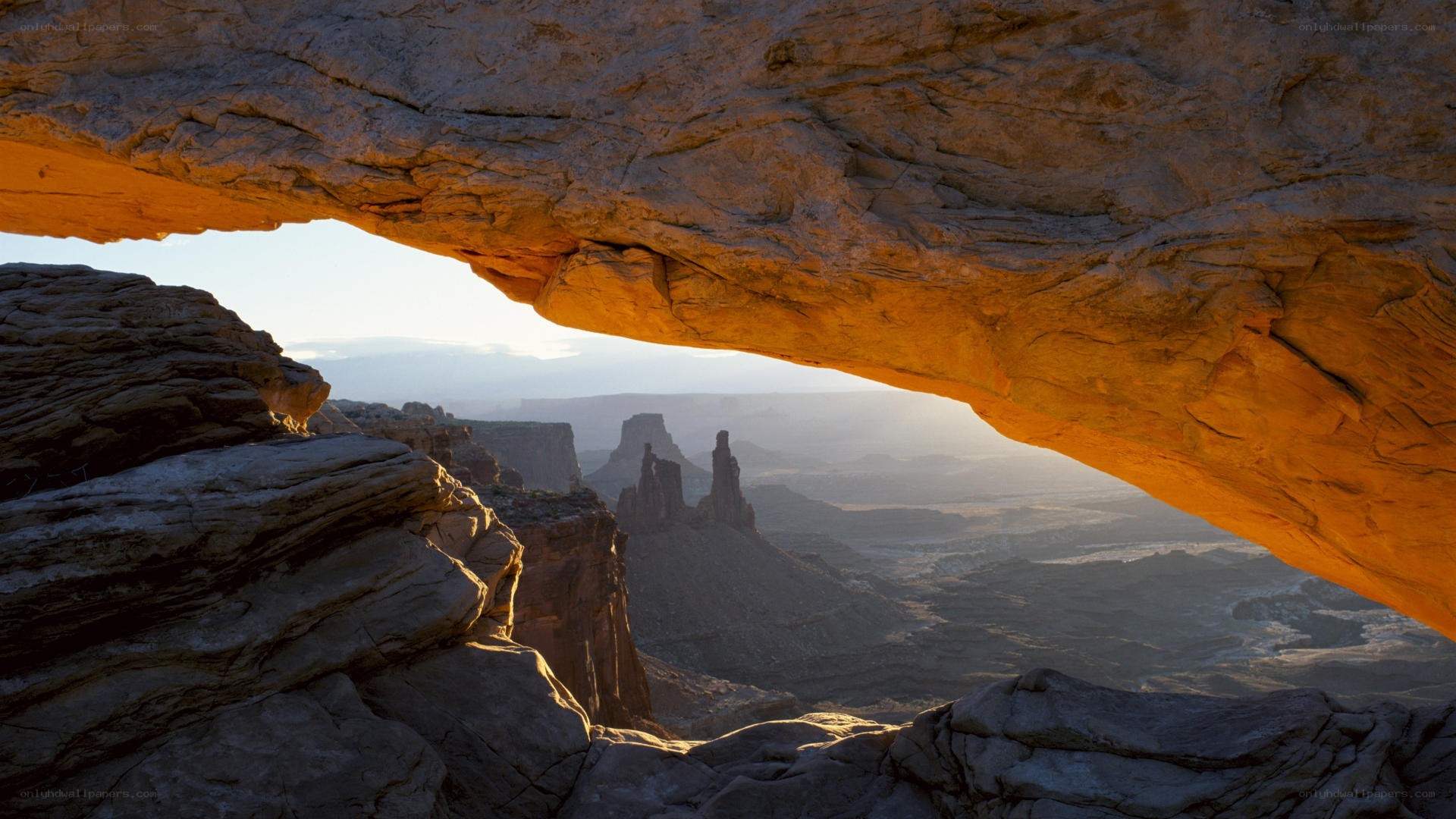 Sunset through natural rock arch