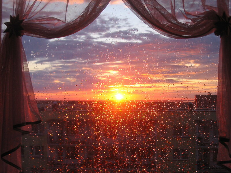 Sunset Through Rain-streaked Window