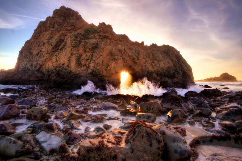 Sunset through sea cave