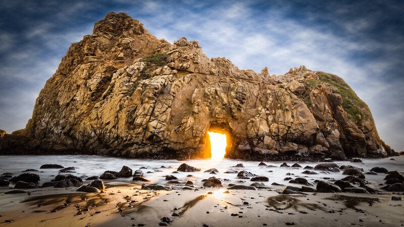 Sunset through sea cave