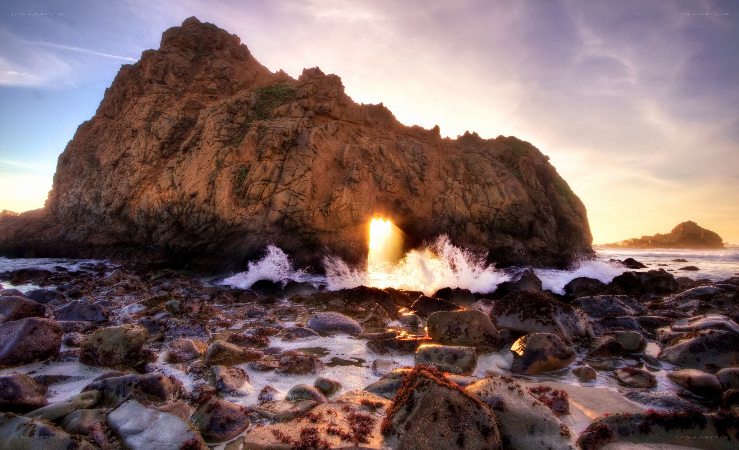 Sunset through sea cave