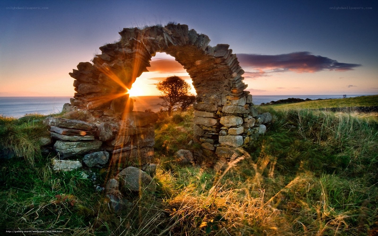 Sunset through stone arch