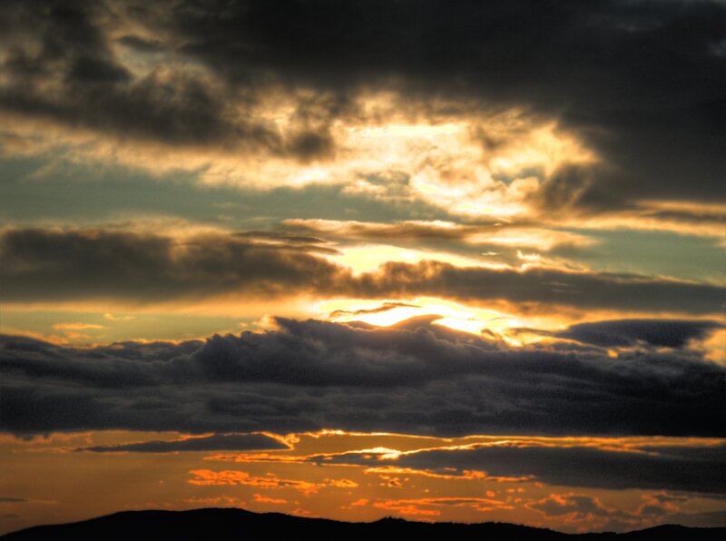 Sunset through storm clouds