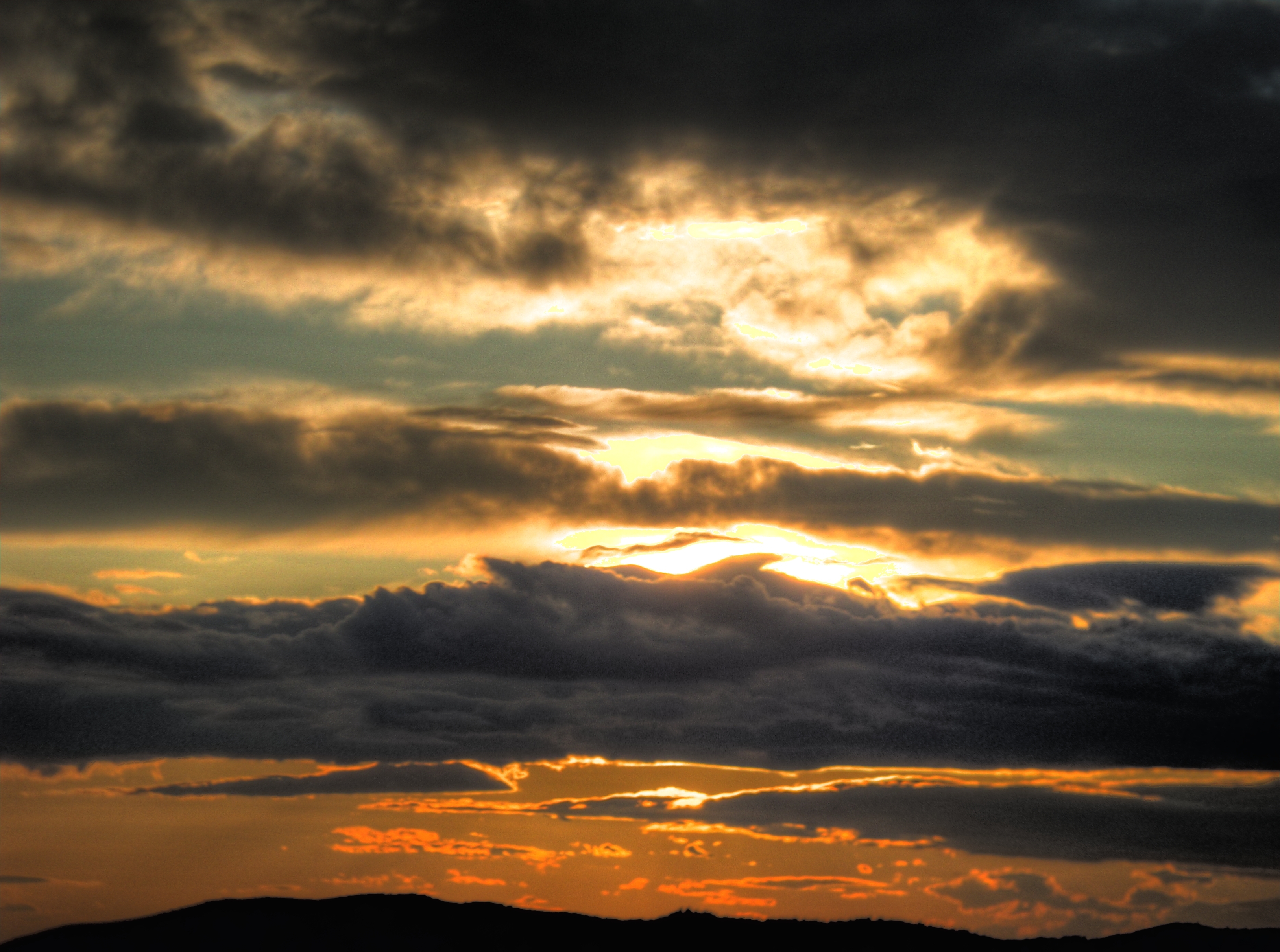 Sunset through storm clouds
