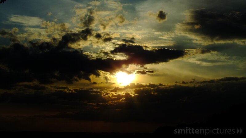 Sunset through storm clouds