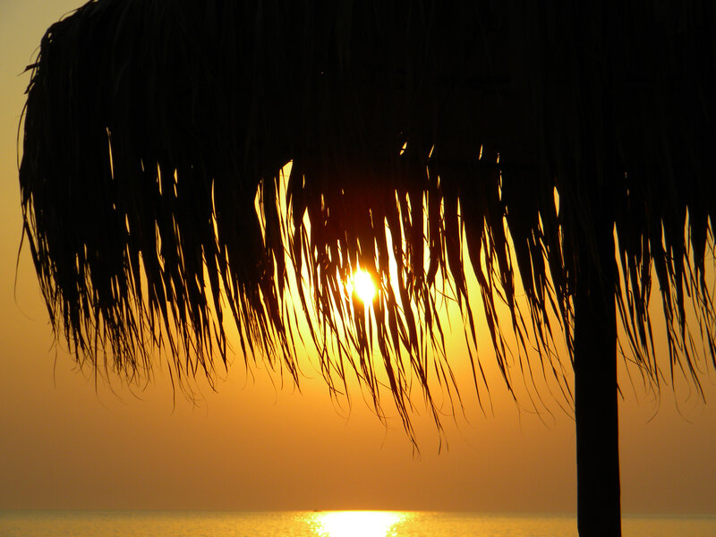 Sunset Through Thatched Roof