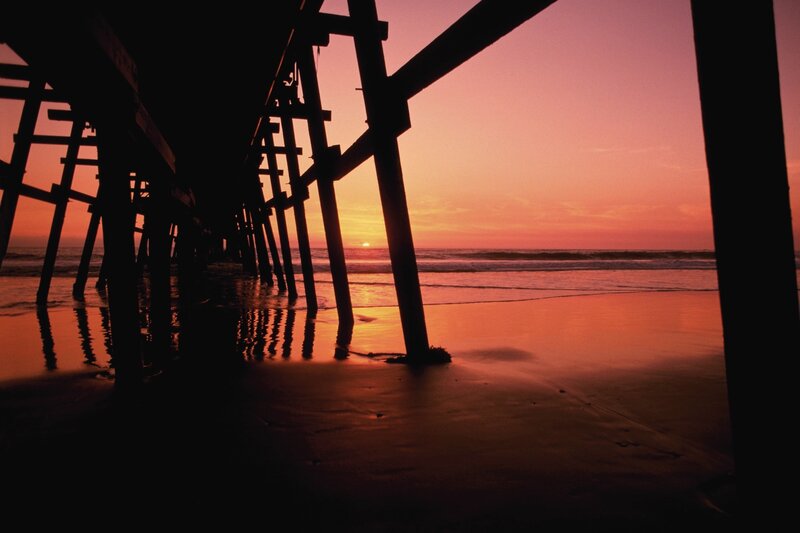 sunset under a pier