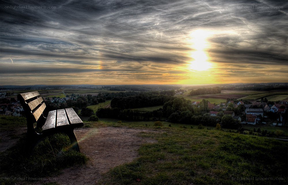 Sunset view from a hilltop bench